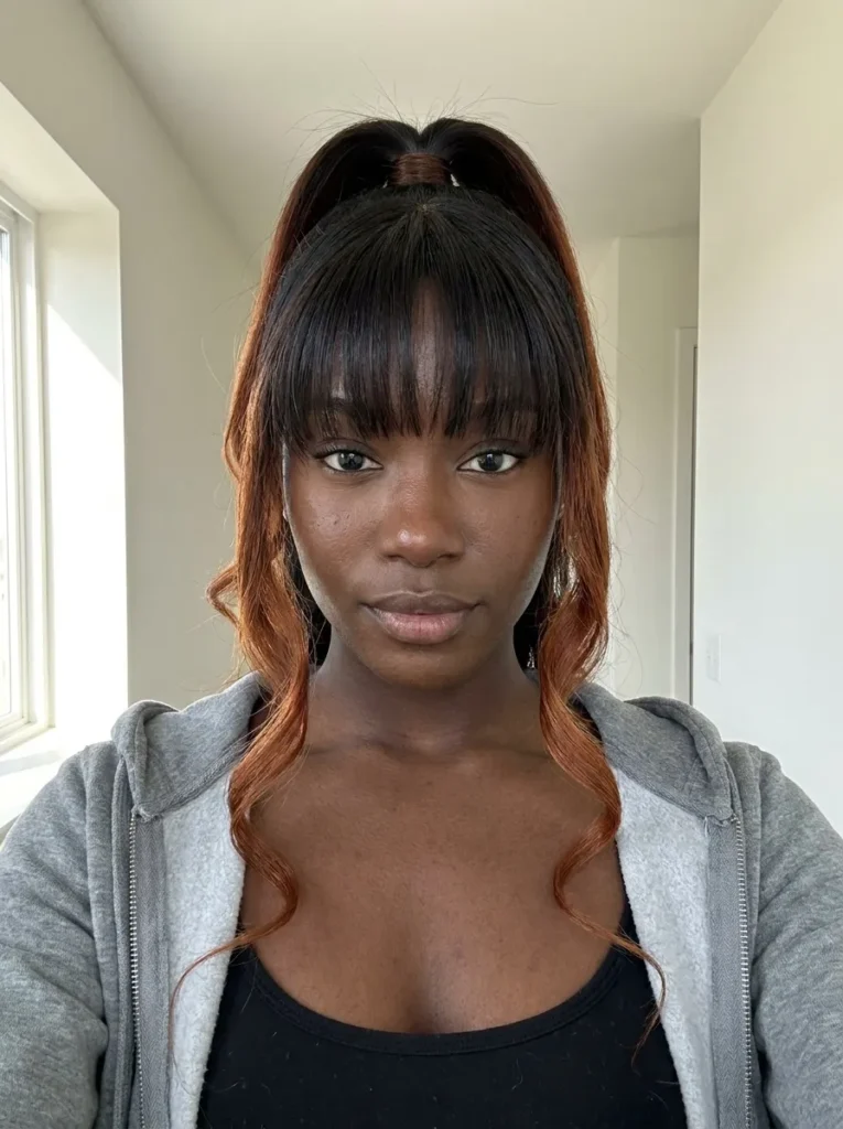 High Ponytail with Face-Framing Tendrils