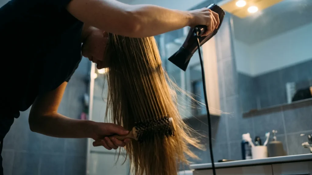 Blow-drying straight hair upside down with a round brush